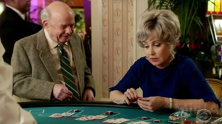Meemaw and Dr. Sturgis talk in her basement casino in "Young Sheldon" (2017-2024)