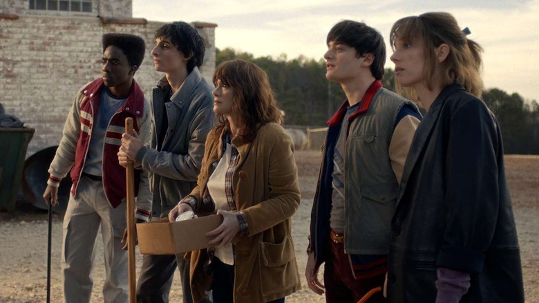 Lucas Mike Joyce Will and Robin looking at something in Stranger Things