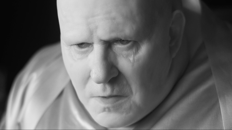 Baron Harkonnen leaning forward