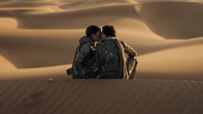 Chani kissing Paul on a dune