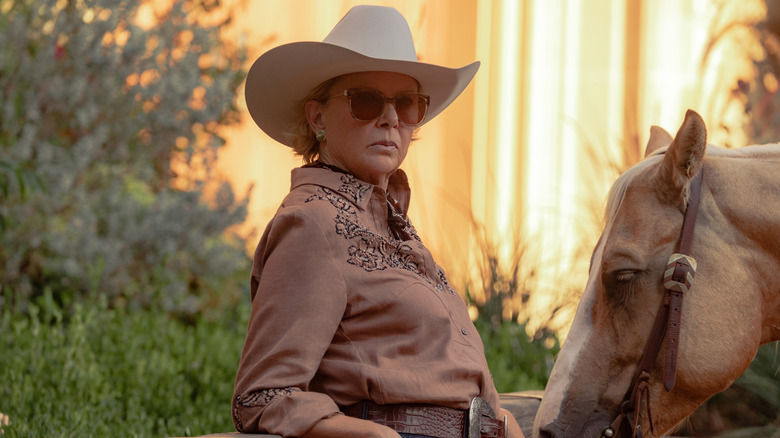 Beulah Jackson leans against a fencepost in "Dutton Ranch"