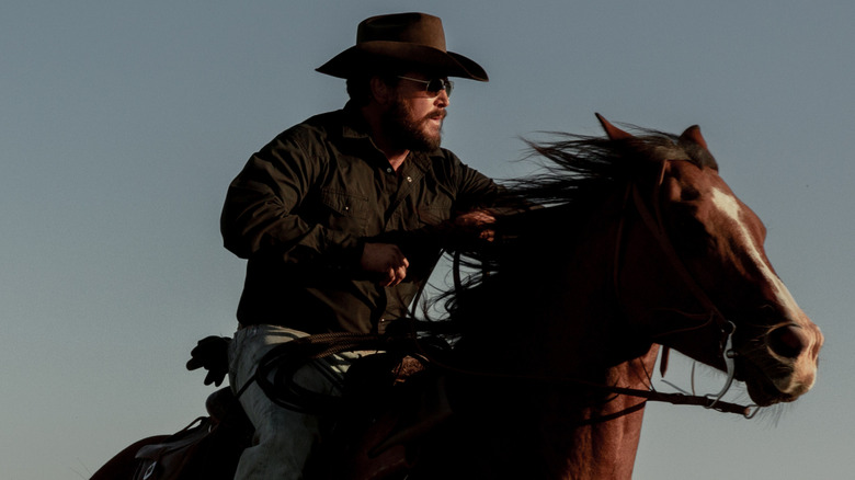 Rip riding a horse in "Dutton Ranch"