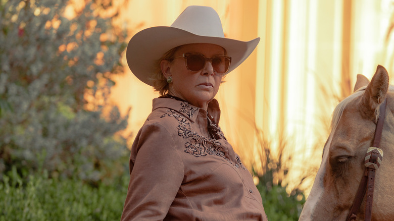 Beulah Jackson tends to a horse in "Dutton Ranch" (2026-)