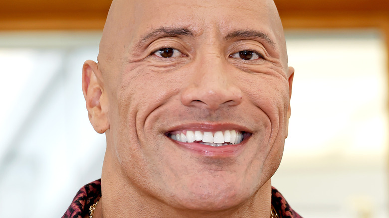 The Rock smiling at press event