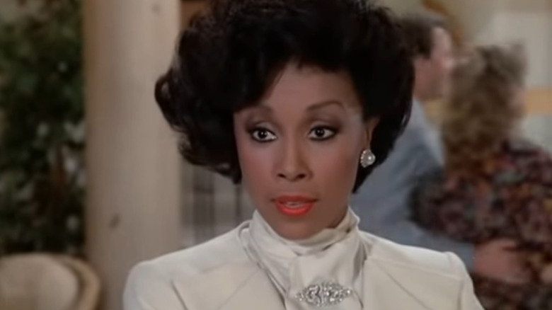 Dominique Deveraux speaking with earrings