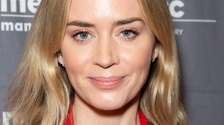 Emily Blunt smirks