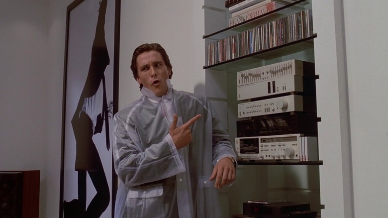 Patrick Bateman points to CD players in "American Psycho" (2000)