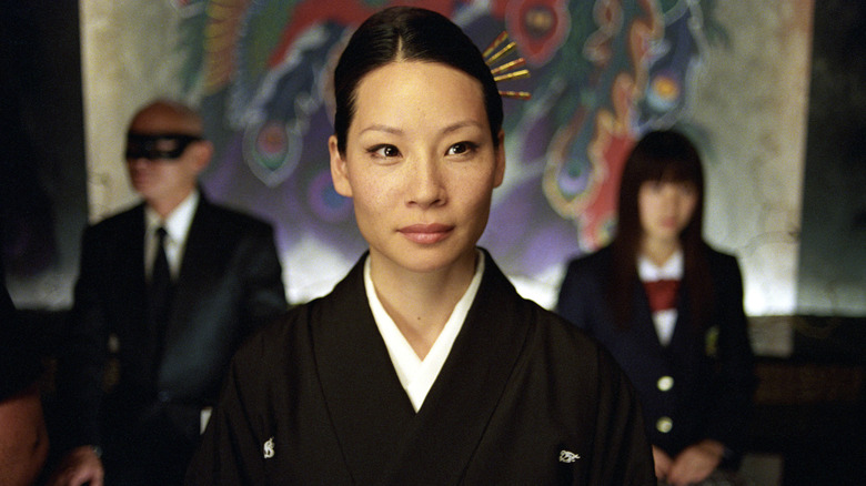 O-Ren sitting in front of Johnny and Gogo (2003)