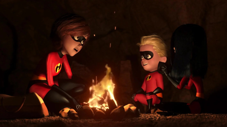 Elastigirl sits with Dash and Violet at a campfire in "The Incredibles" (2004)
