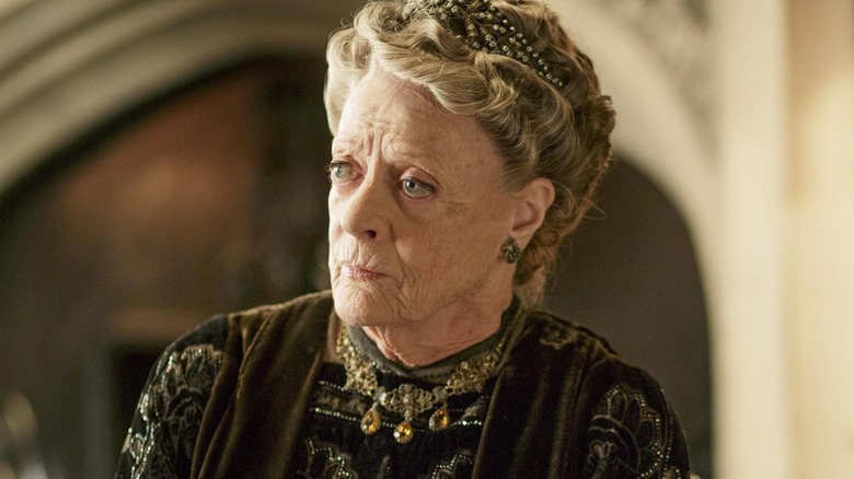 Maggie Smith looks left