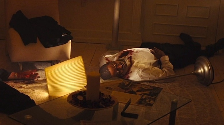 Detective Di Santos bleeds on floor