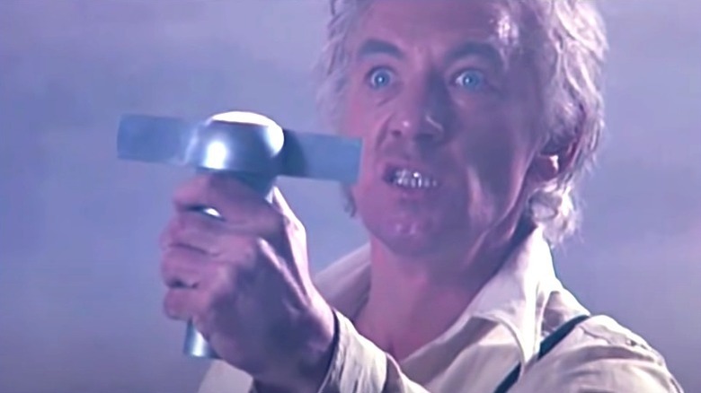 Ian McKellen holding a strange artifact