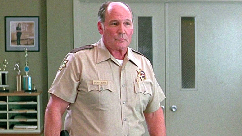 Joseph Whipp wears a sheriff's uniform