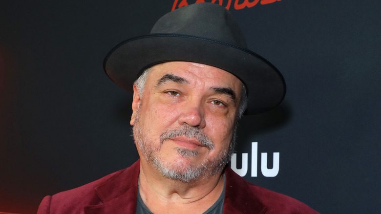 W. Earl Brown wears a hat