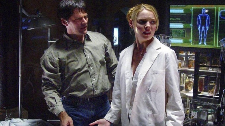 Detective Ryan reacts to Eve in a lab