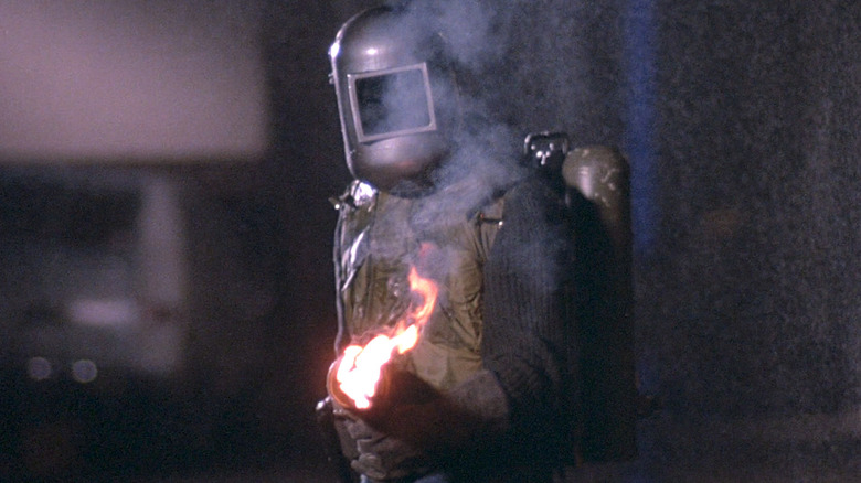 The Exterminator holding a flamethrower