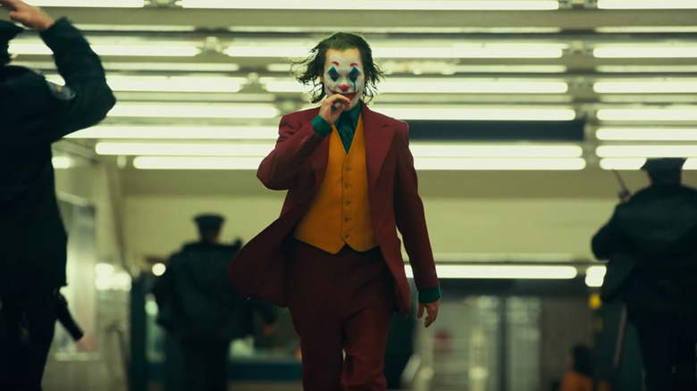 Joker walks down a hallway in "Joker" (2019)