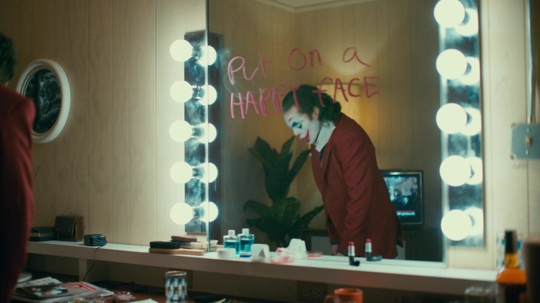 Arthur Fleck looking away from the mirror in "Joker" (2019)