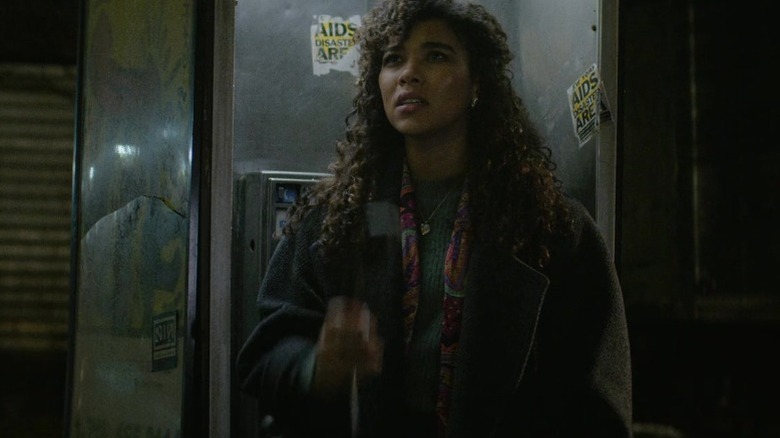 Susan standing in a phone booth