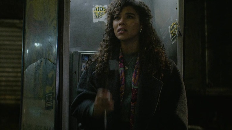 Susan standing in a phone booth