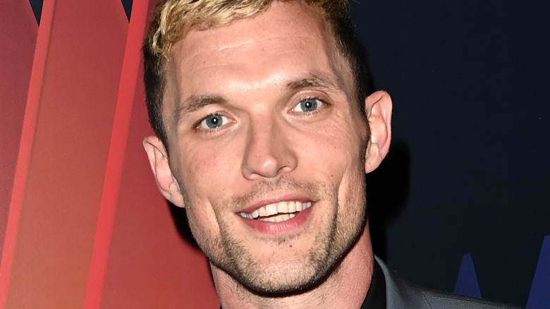 Ed Skrein smiling at a film festival