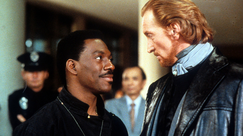 Chandler Jarrell and Sardo Numspa have a staredown in "The Golden Child" (1986)