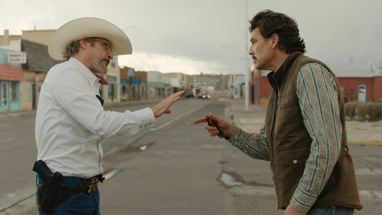Sheriff Joe Cross and Mayor Ted Garcia arguing in the street