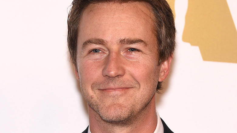 Edward Norton smirks