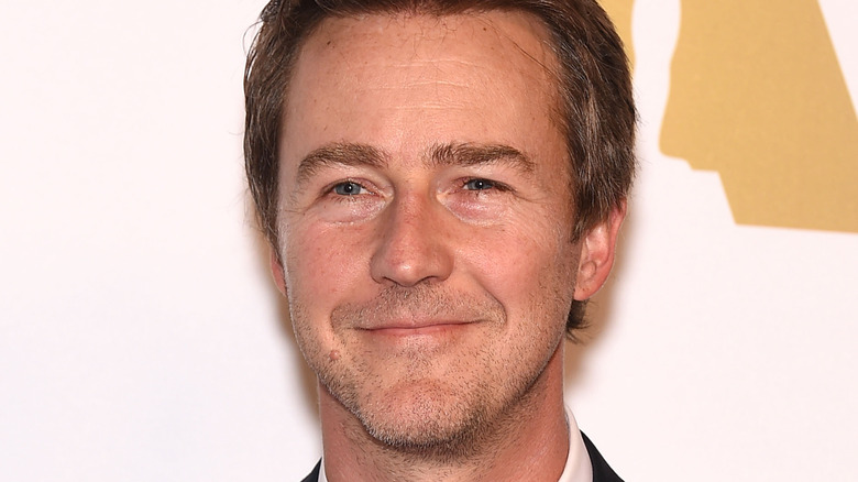 Edward Norton smirks