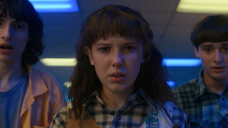 Mike and Will next to Eleven looking shocked