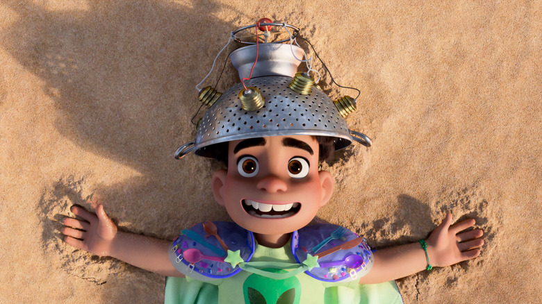 Elio lying on beach hoping for abduction