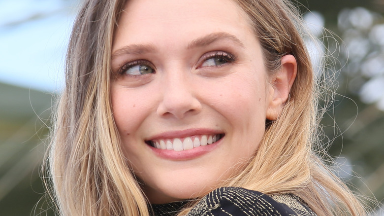 Elizabeth Olsen smiling over her shoulder