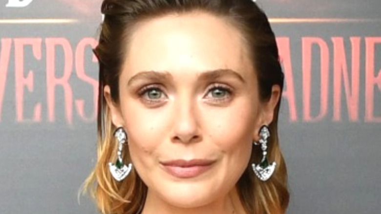 Elizabeth Olsen smiling at an event