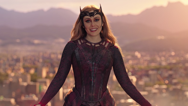Scarlet Witch smiling with city behind