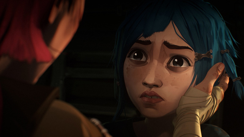 Vi clasping Powder's face