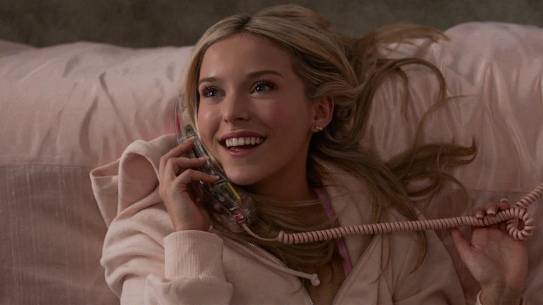 Elle Woods grins while talking on the phone in 