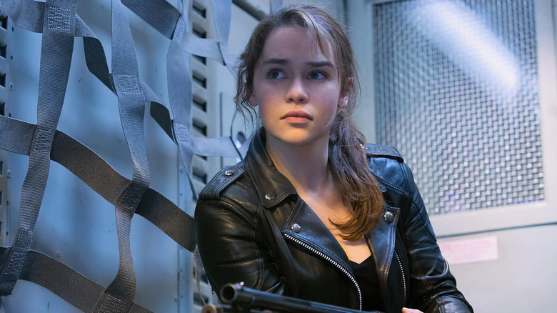 Sarah looking at someone and holding a gun in Terminator: Genisys