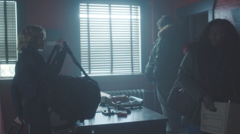 Emilia Harcourt puts bag on desk