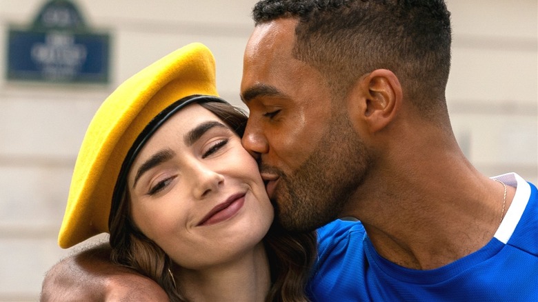 Emily Cooper (Lily Collins) and Alfie (Lucien Laviscount) share a kiss