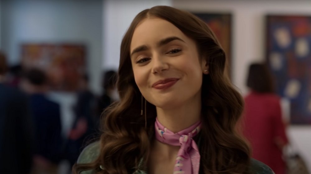 Emily (Lily Collins) smiles during a scene included in Netflix's Emily in Paris trailer.