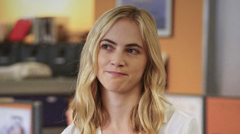 Agent Bishop smiling tightly