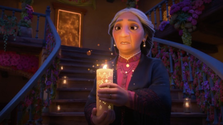 Mirabel's abuela holding a candle