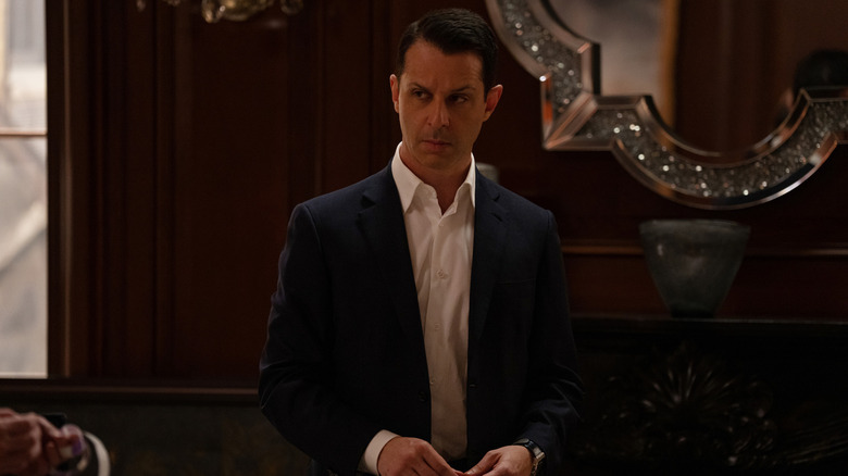 Kendall glowers wearing suit