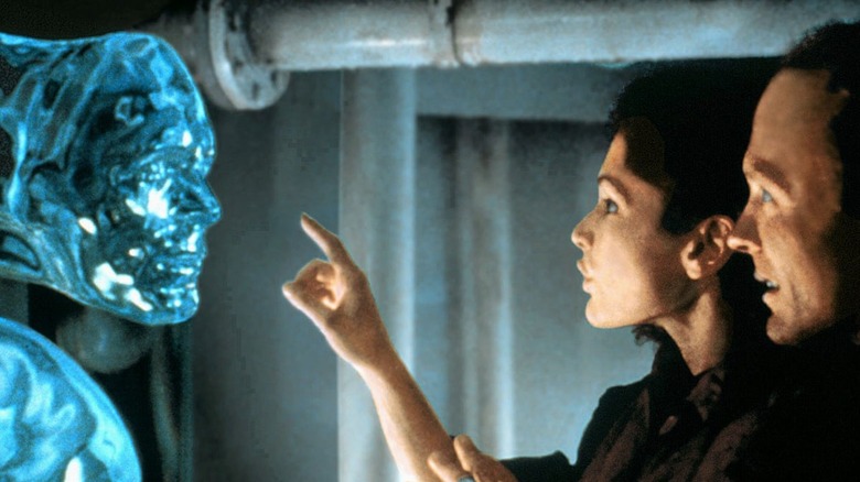 Ed Harris touches an alien as Virgil in The Abyss