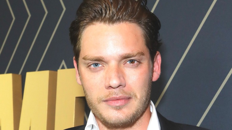 Dominic Sherwood with slicked back hair