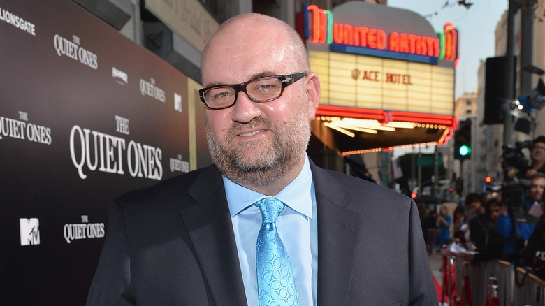 Director John Pogue blue tie movie premiere