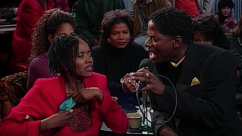 T.C. Carson singing to Erika Alexander