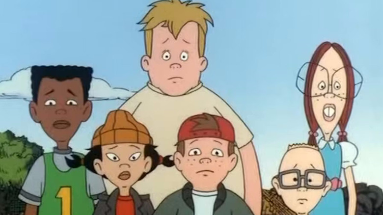 Victor, Mikey, Gretchen, Spinelli, TJ, and Gus stand together with concerned looks in Recess.