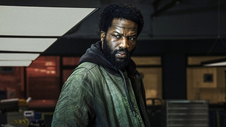 Elliot Carter looking over his shoulder in Gangs of London