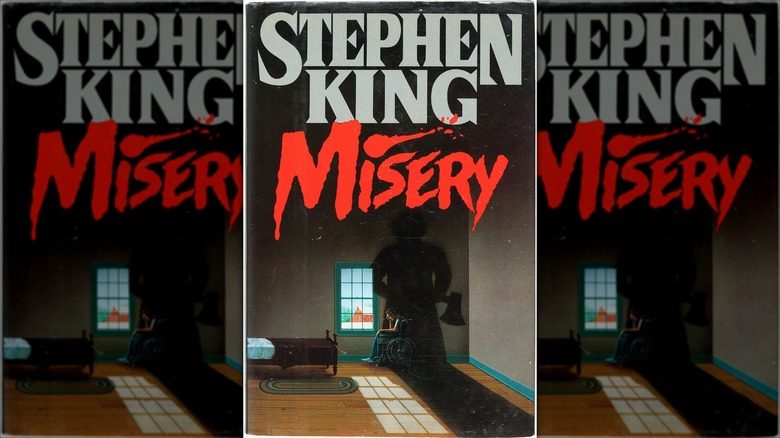 The shadow of a woman with an axe stands over a wheelchair-bound man on the cover of "Misery" (1987)